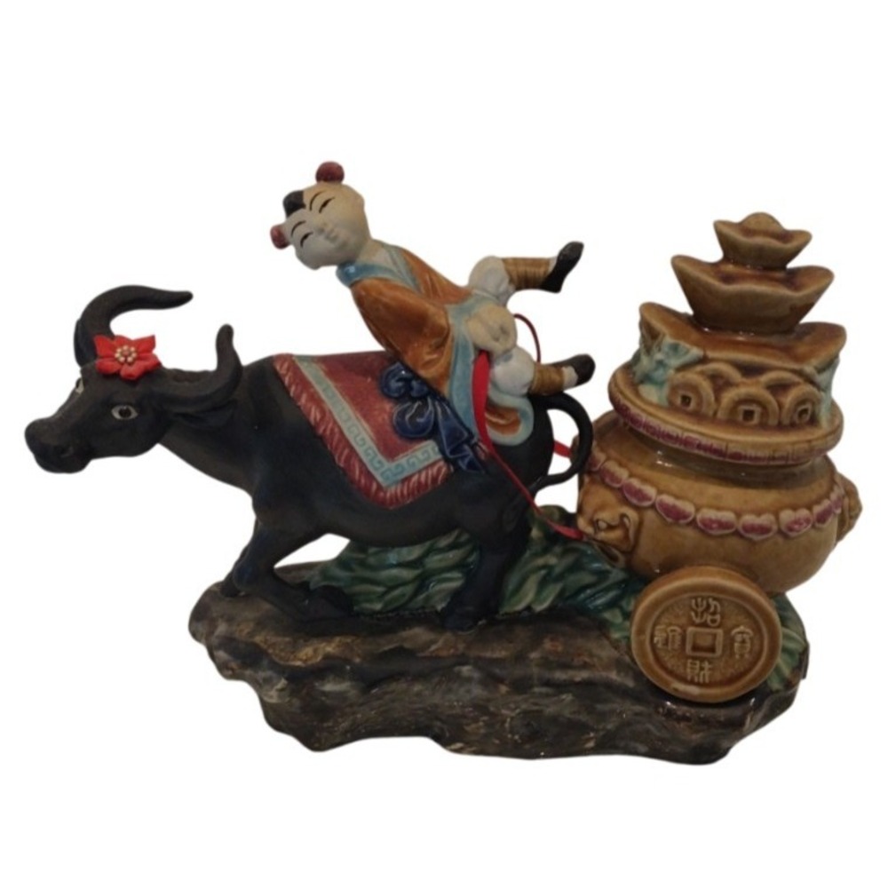 Chinese glazed pottery  figurine Boy Riding An Ox With A Gold Of‎ Coin Pot Lucky